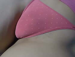 Panty fetish. Close-up in my puffy pussy cameltoe in a pink panties before going to bed.